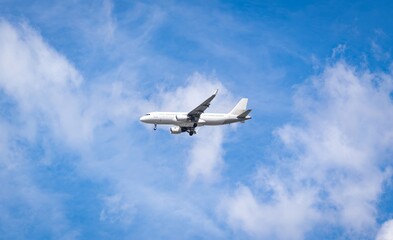 Passengers commercial airplane flying above clouds. Airplane in the sky, over the cloudy sky