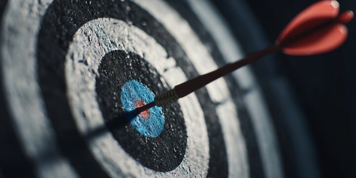 Dart hits bullseye on target during evening competition in local game room