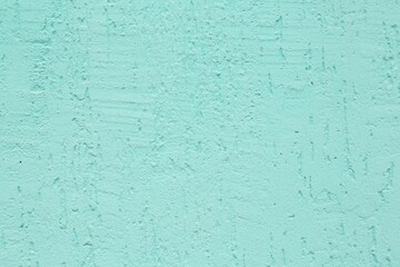 Turquoise cement textured surface as background, closeup