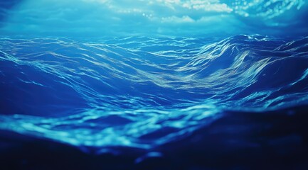 Deep, dark ocean waves, lit from above
