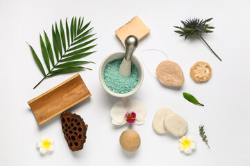 Plakat Composition with mortar of sea salt, spa accessories and flowers on light background