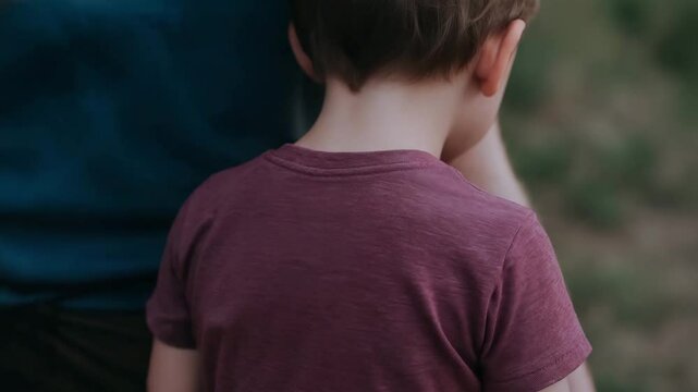 Supportive hand gently rests child back conveying emotional intelligence care and connection tender moment of support and nurturing relationships