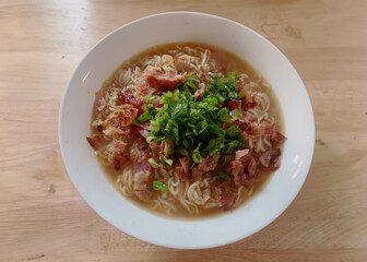 A Bowl of Authentic Ramen Noodles At a Noodle Shop, Pork Garnish, Green Onion Garnish, Ramen Bowl, Table, Saimin, Natural Lighting, Lunch Bowl