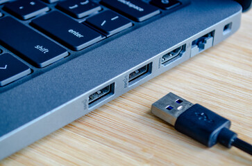 USB plugged into high speed port symbolizing convenience and cyber risk trade off