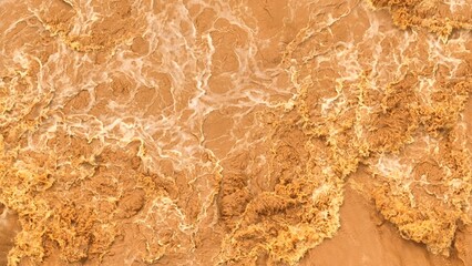 Overhead perspective shows floodwaters surging with sediment, reflecting how greenhouse gas...