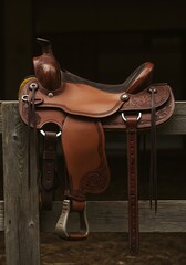 Minimalist close-up of a traditional leather saddle with intricate tooling