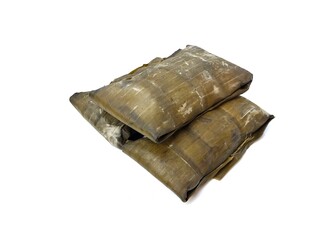 Pesor or Indonesian traditional food made from rice and wrapped in banana leaves, isolated on white background 