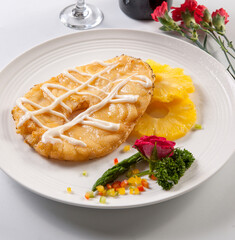 Pineapple slices with fried cod
