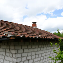 Old and very dangerous asbestos roof. Asbestos dust in the environment. Asbestos removal