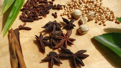 Various spices on a wooden cutting board. Authentic traditional spices.