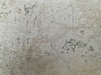 Close up of old cement wall surface with fine cracks.