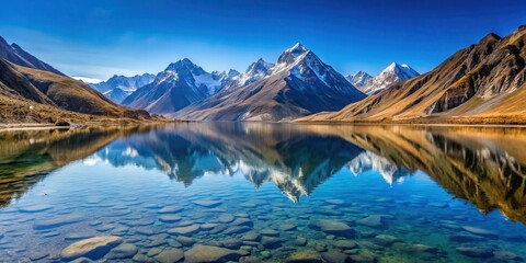 Obraz premium Crystal clear water of Changu Lake reflected in the surrounding mountains