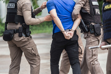 Police steel handcuffs,Police arrested,Professional police officer has to be very strong,Officer Arresting,"Police Catch the Culprit".