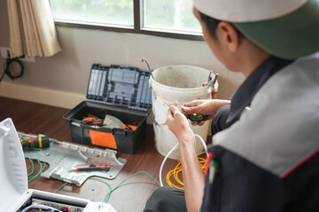 Air conditioning technician connecting electric wires to install new air conditioners, Repairman fix air conditioning systems, Technician man service for repair and maintenance of air conditioning