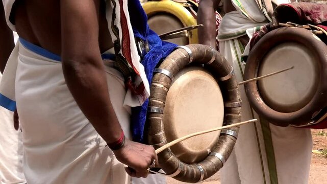 Artists playing Thavil, a South Indian percussion musical instrument