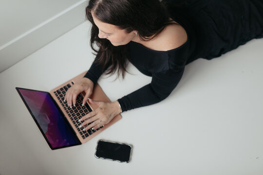Influencer working on laptop creating social media content