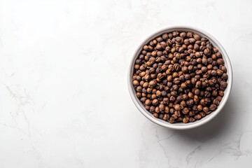 Bowl of Whole Cloves on White Marble Background with Copy Space for Text and Design Elements