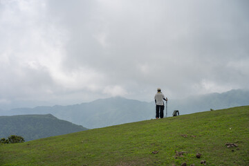 The woman standing alone on a mountaintop