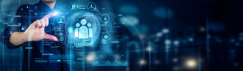 Businessman touching LEADERSHIP icons symbolizes vision, influence, empowerment, strategy,...