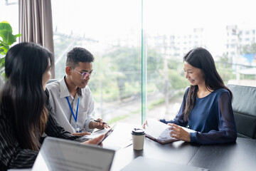 Examiner reading a resume during job interview at office Business and human resources concept.