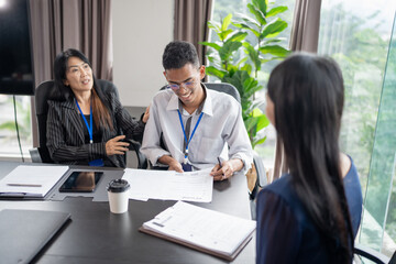 Obraz premium Examiner reading a resume during job interview at office Business and human resources concept.