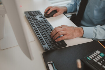 a businessman is sitting in his private office, an entrepreneur is working diligently, the chief accountant is reviewing documents and budget figures to present to the executives in a meeting