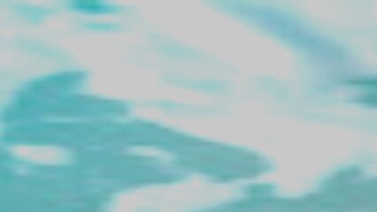 Obraz premium A soft, blurry image featuring a blend of teal and gray tones. The colors transition smoothly, creating a calming and ethereal effect.