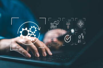 Robotic Process Automation (RPA) technology to automate business tasks with AI. Concept with expert setting up automated software on laptop computer. Digital transformation and change management.