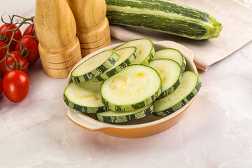 Raw green zucchini slices for cooking