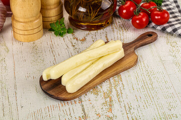 White mozzarella sticks over board