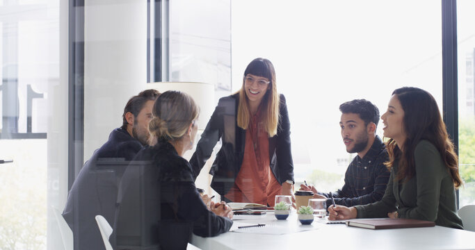 Team, leader and discussion with business people in conference room for financial planning. Group, meeting and woman with smile, ideas or brainstorming for investment collaboration at finance firm