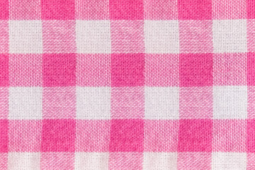 background in a checkered white with pink fabric close up