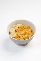 Colorful top-view bowl of fresh fruit, oats, and seeds showcasing a healthy, organic, vegan breakfast rich in vitamins and fiber.