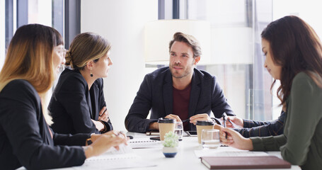 Fototapeta premium Group, business people and planning in office for idea, brainstorming or financial strategy. Discussion, team meeting and conversation with manager for investment proposal, budget and collaboration