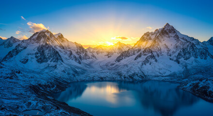Fototapeta premium Majestic Sunrise over Snowy Mountain Peaks and Serene Glacial Lake Breathtaking Winter Landscape in the Himalayas