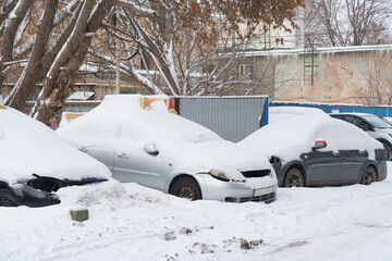 Cars covered with snow in Parking lot