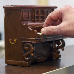 Hand Playing little Toy Piano