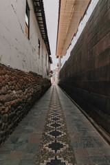 Ancient Inca stone wall on traditional street in Cusco, Peru