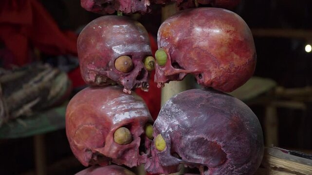 Aghori post-mortem ceremony ritual skulls scary close-up inside aghori shelter, Varanasi, India 