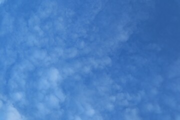 Softly Textured Altocumulus Clouds Spread Across the Azure Sky