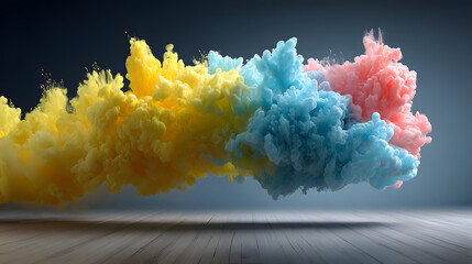 Colorful vibrant smoke floats in mid-air with a bright yellow, blue, and pink hue illuminating a grey wooden floor creating an ethereal abstract image.