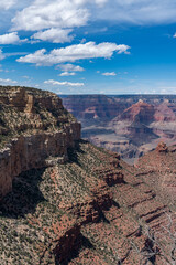 Panoramic views of the Grand Canyon, Arizona, USA, showcasing the dramatic landscape, layered rock formations, and vivid colors under a clear sky. Perfect for travel and nature themes.