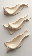 Three Creamy Beige Liquid Splash Shapes in Triangular Layout on White Background with Fluid Motion