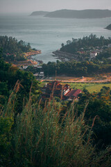 Cu Lao Cham, Hoi An, Vietnam – May 12 2025: View of the island coastline with traditional...