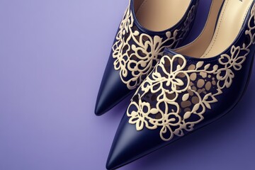 Elegant navy blue heels with intricate floral designs.