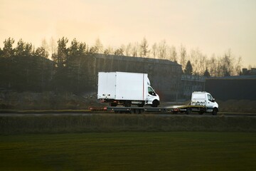 Auto rescue truck towing vehicle on road