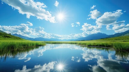 Obraz premium Serene Landscape Featuring Calm Water, Lush Green Grass, Majestic Mountains, and Bright Cloudy Sky Under Vibrant Sunlight Reflection Near Tranquil Lake