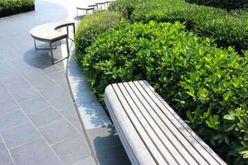 Classic long wooden chair in the garden