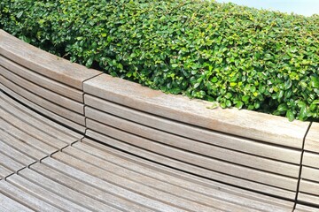 Classic long wooden chair in the garden