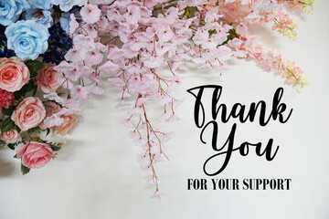 Thank You for your support text with flowers decorations on wooden background